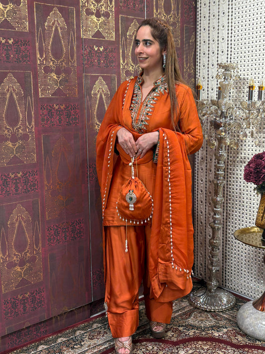Elegant short kurta set is crafted in luxurious satin crape fabric