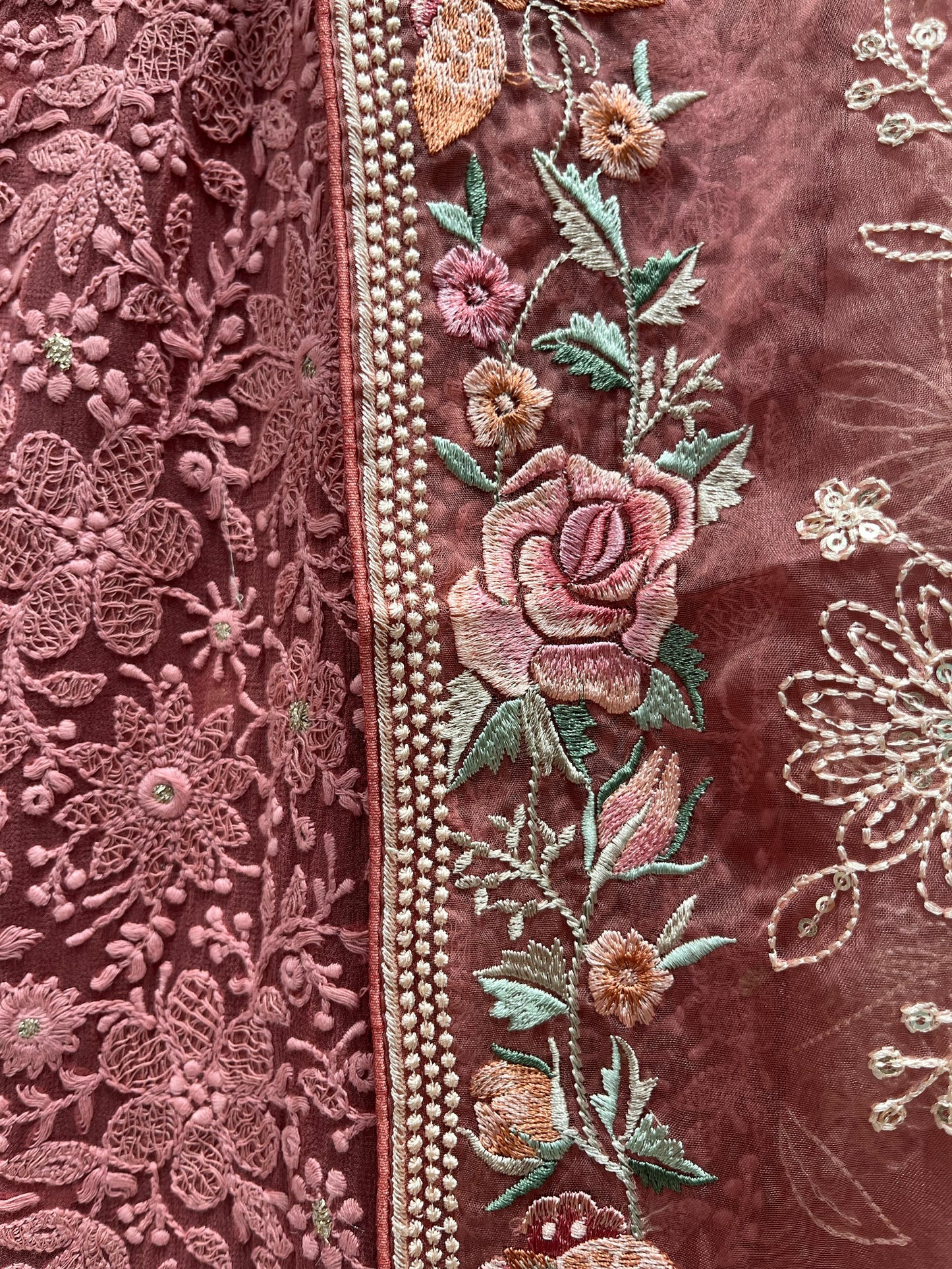 Elegance with this premium unstitched suit set, featuring a pure Georgette top adorned