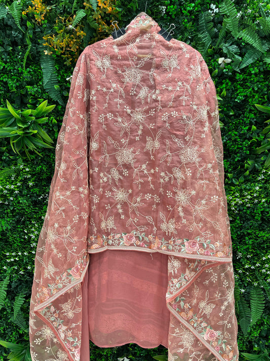 Elegance with this premium unstitched suit set, featuring a pure Georgette top adorned