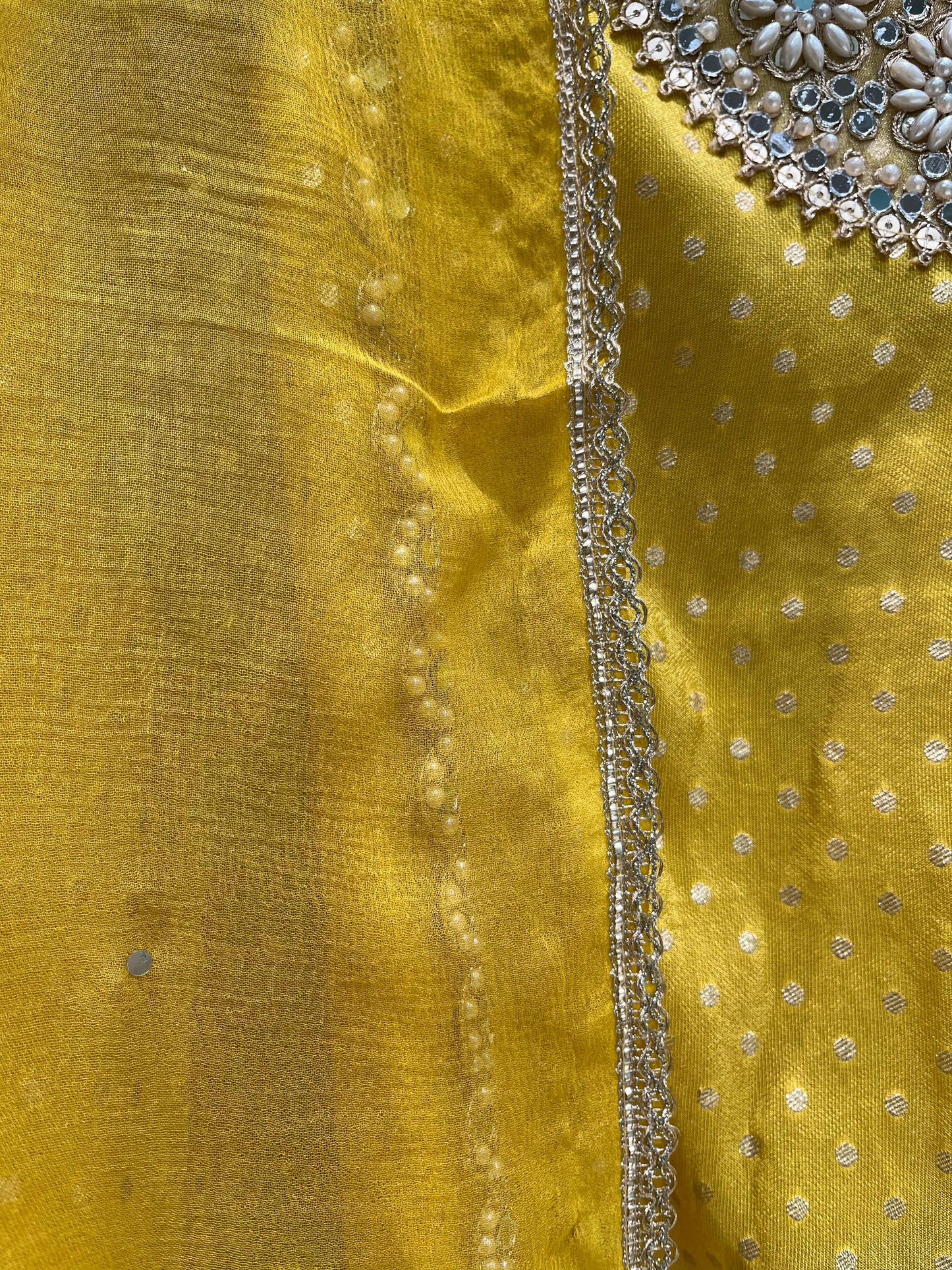 Step into timeless grace with this exquisite unstitched suit set