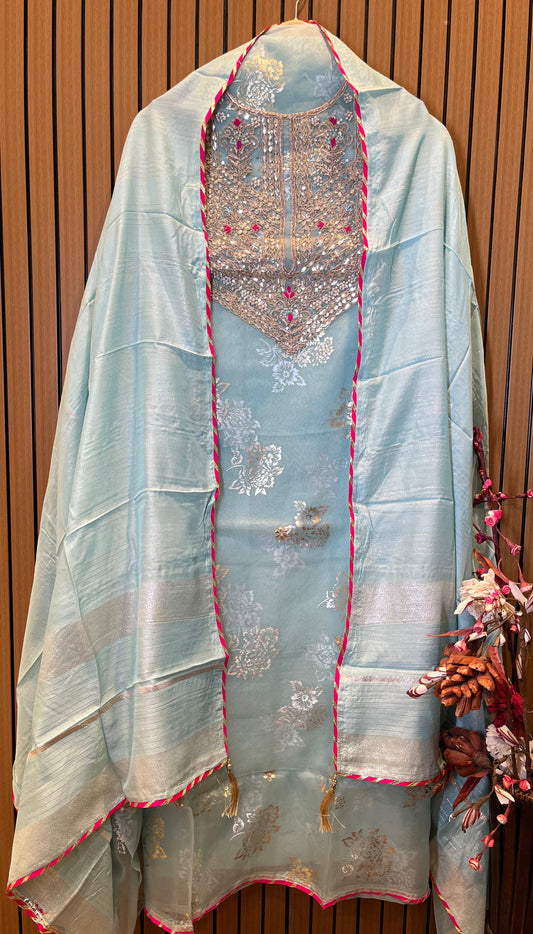 Discover timeless elegance with our premium unstitched suit