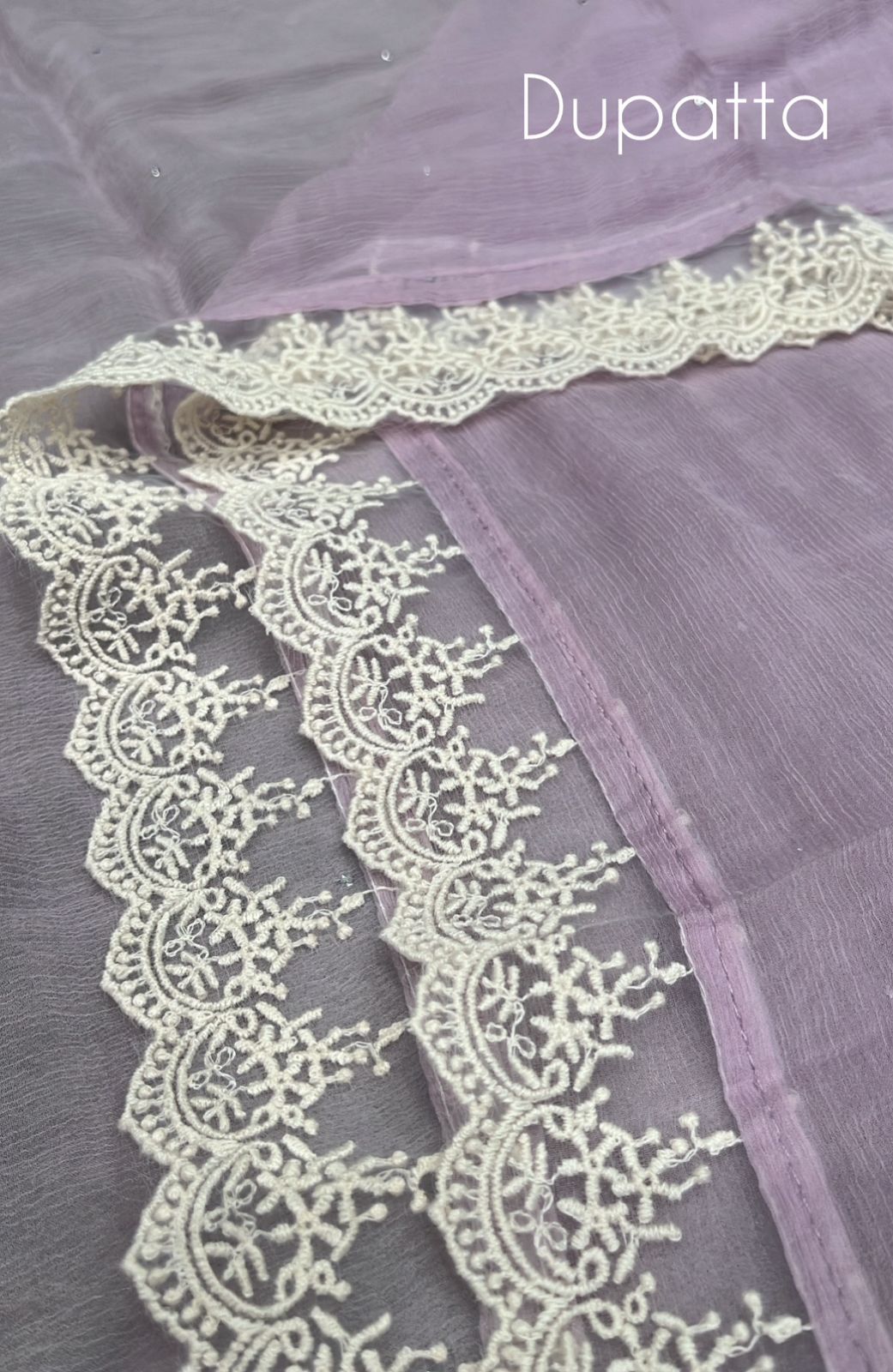 Step into timeless style with this unstitched Kota Doriya suit set