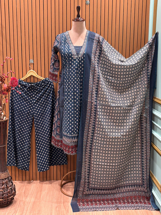 This trending ethnic suit features a navy blue base with intricate block prints