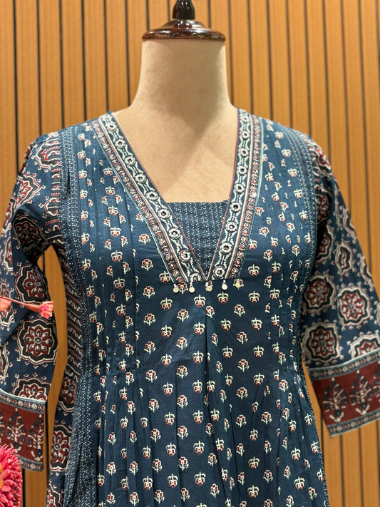 This trending ethnic suit features a navy blue base with intricate block prints