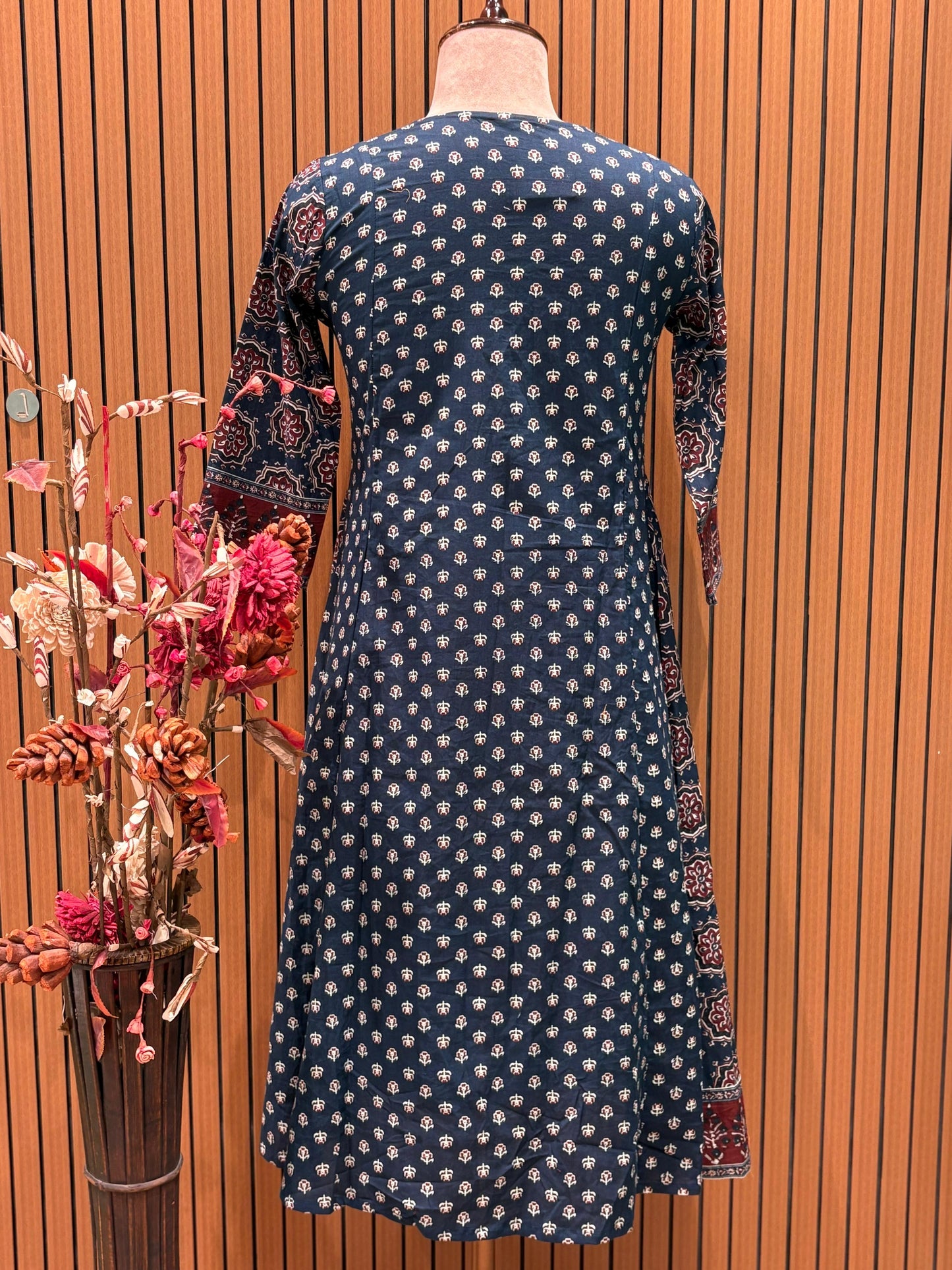 This trending ethnic suit features a navy blue base with intricate block prints