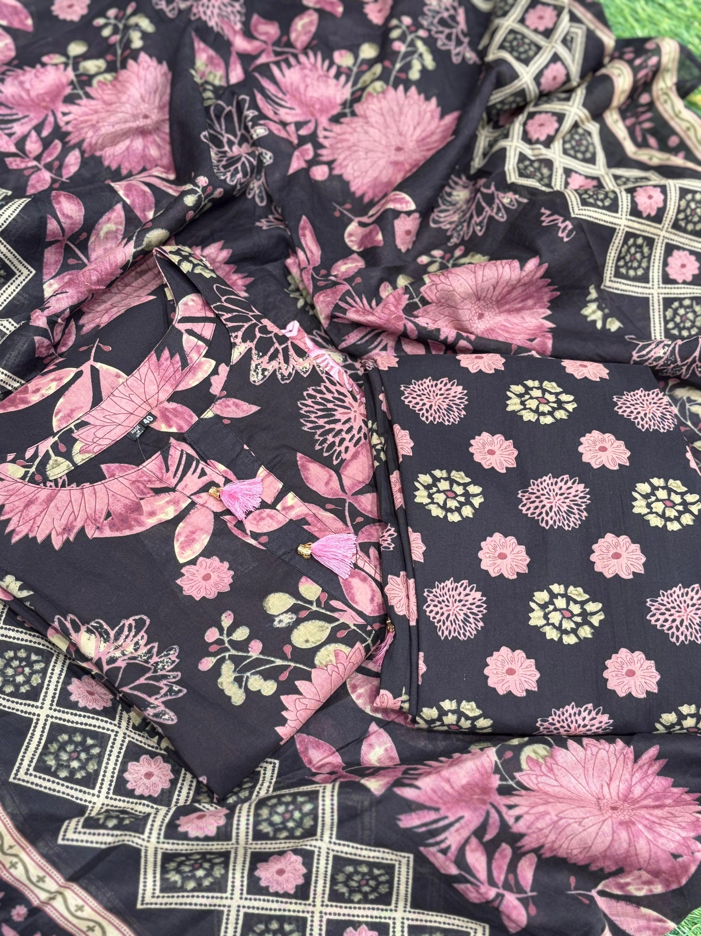 This elegant floral-printed suit features a deep brown base