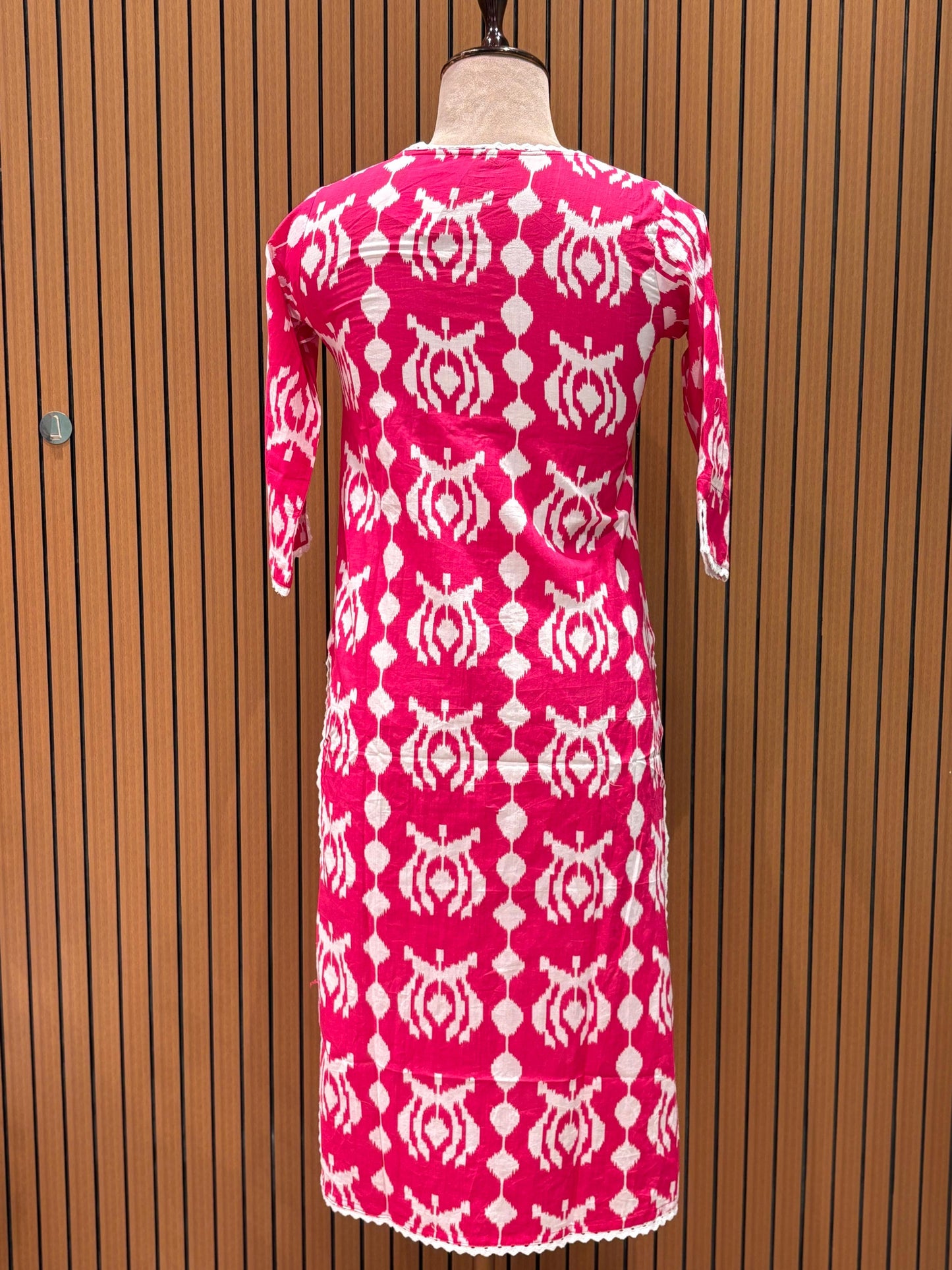 Vibrant pink and white ethnic suit set features a bold printed kurta