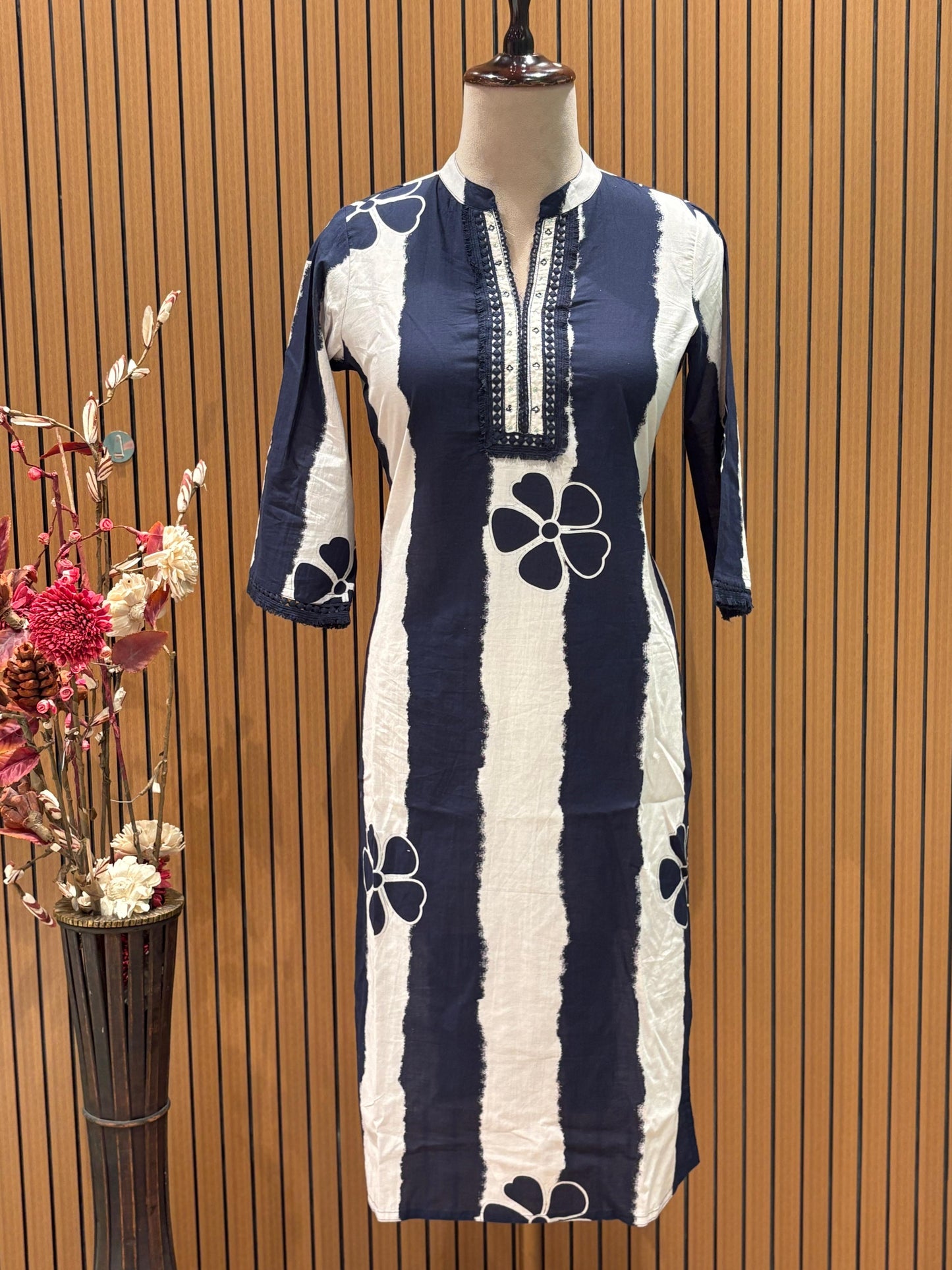 Chic navy and white suit set showcases a floral striped kurta