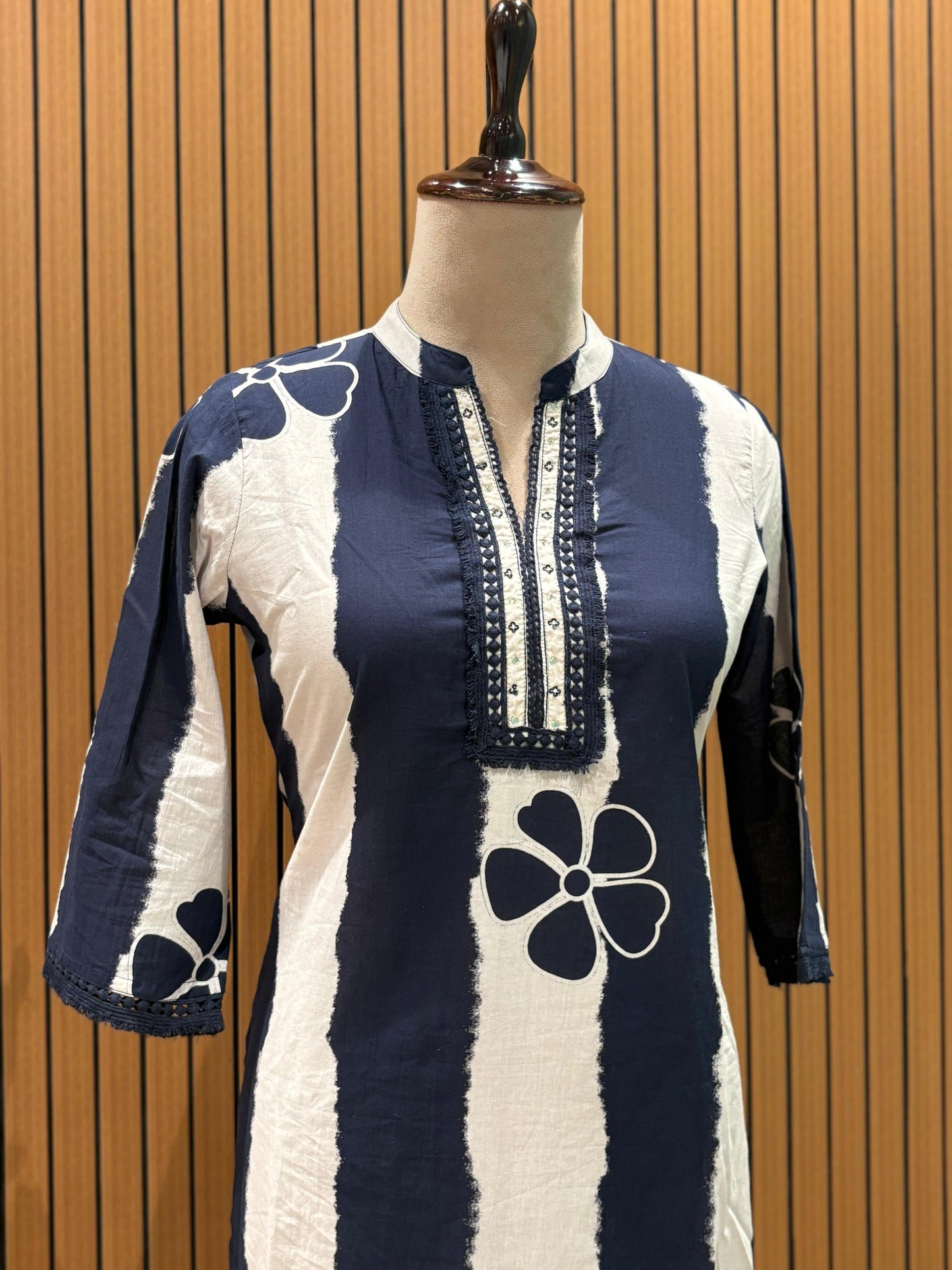 Chic navy and white suit set showcases a floral striped kurta