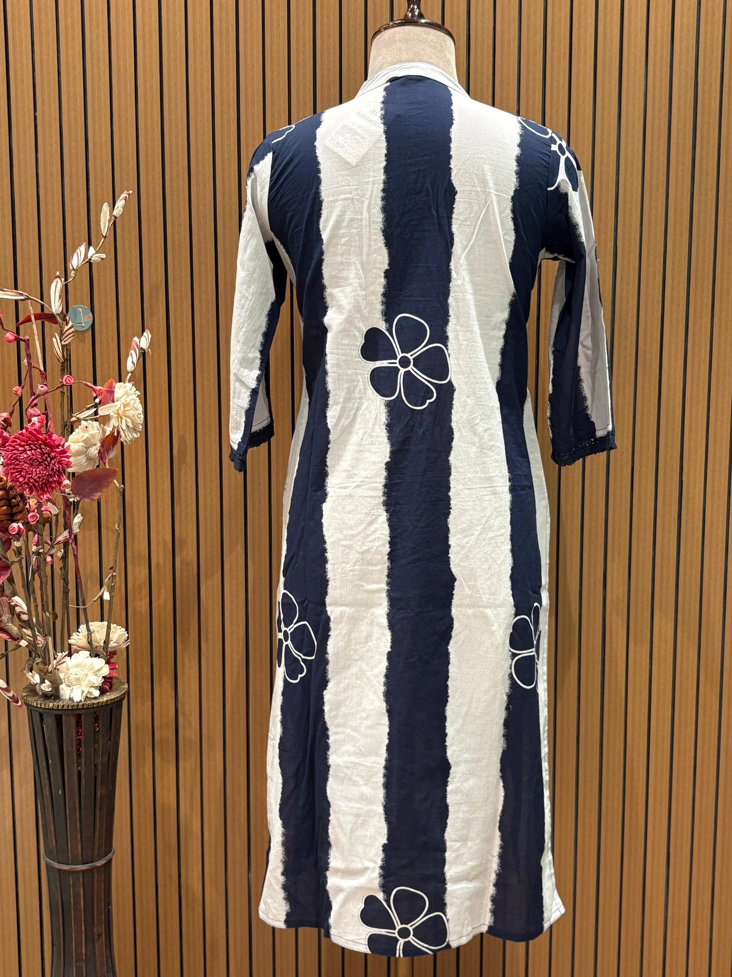 Chic navy and white suit set showcases a floral striped kurta