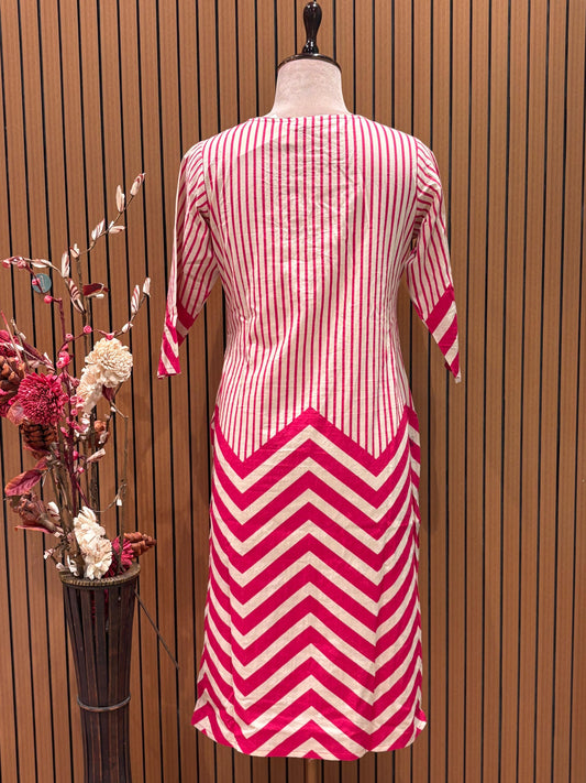 Vbrant pink and cream suit set features a stylish mix of vertical