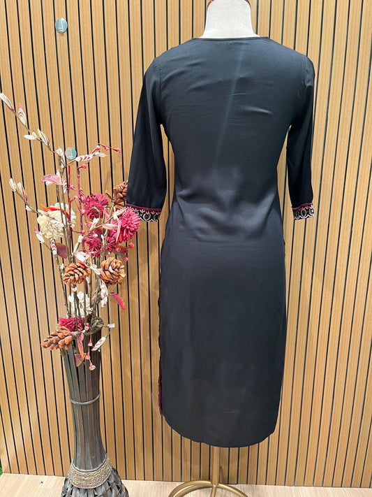 Elegant black salwar suit features intricate neckline embroidery