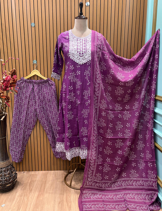 Vibrant purple ethnic set showcases intricate white thread embroidery