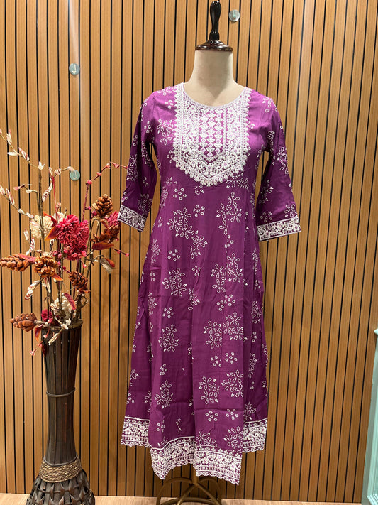 Vibrant purple ethnic set showcases intricate white thread embroidery