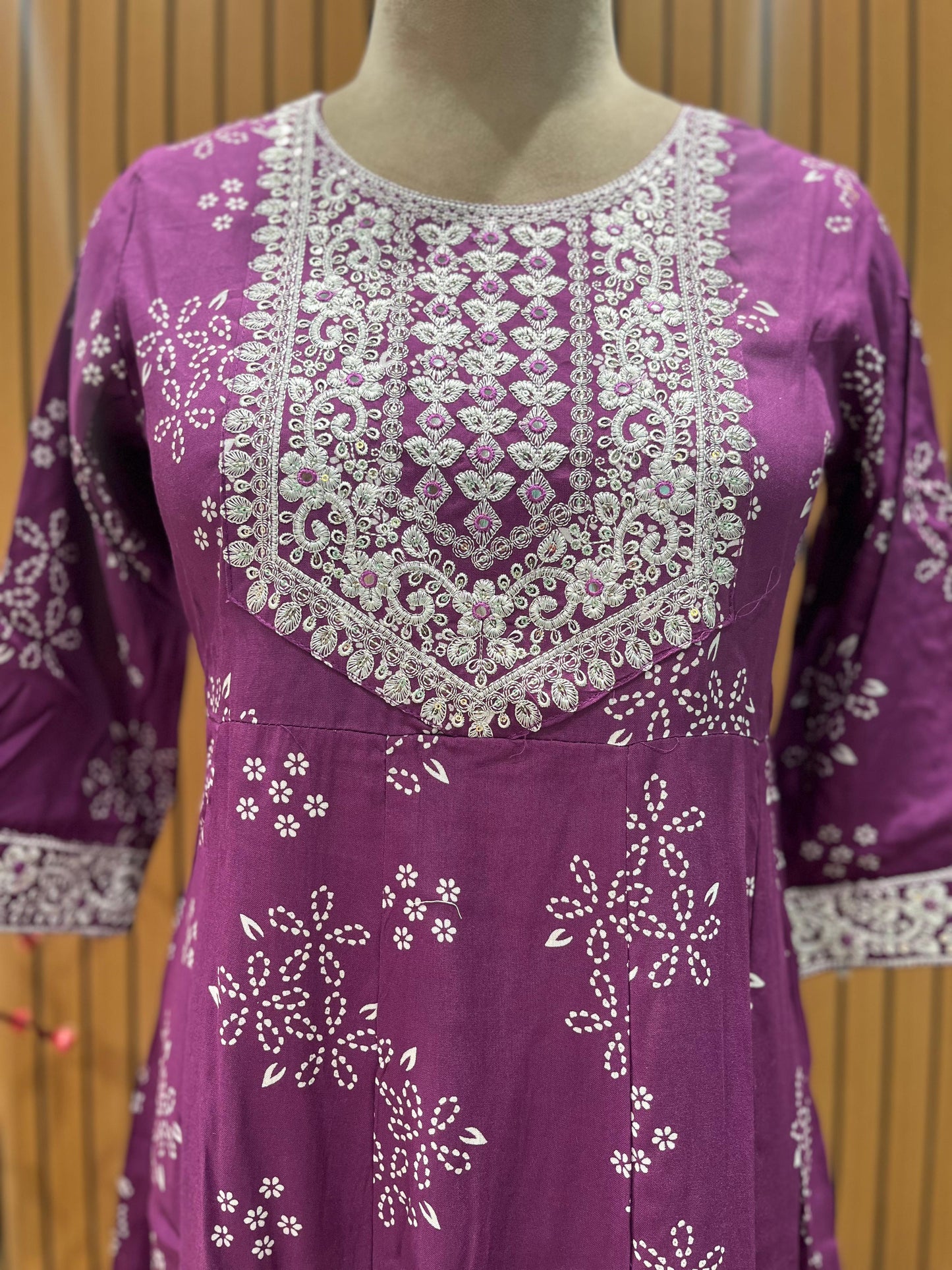 Vibrant purple ethnic set showcases intricate white thread embroidery