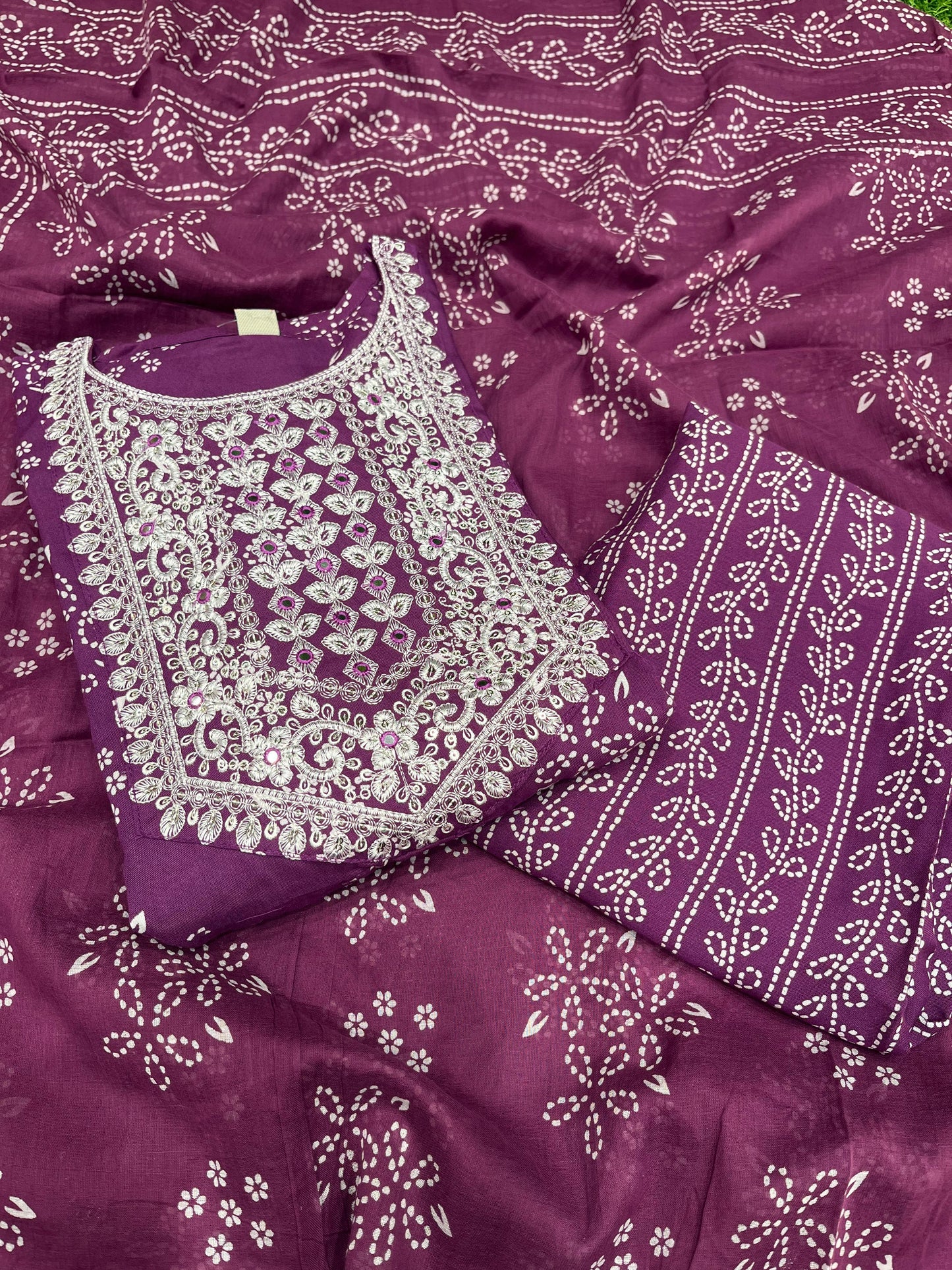 Vibrant purple ethnic set showcases intricate white thread embroidery