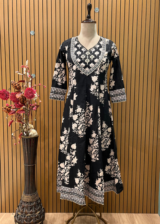 Black ethnic ensemble features elegant floral and vine prints
