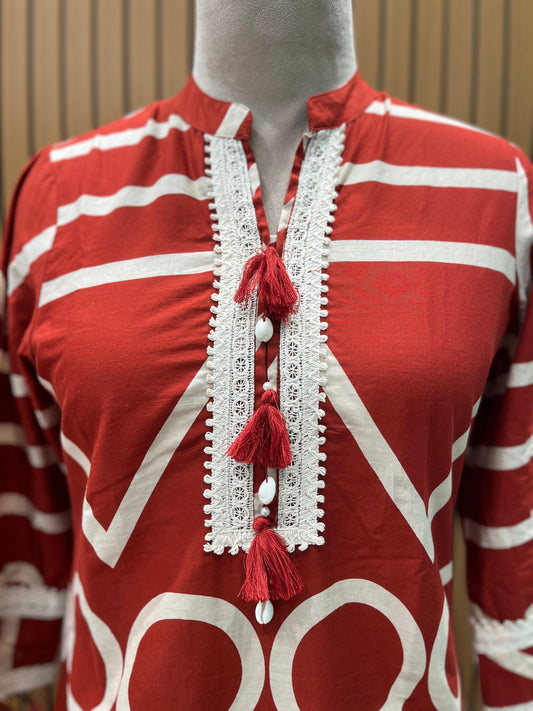 Trendy co-ord set features a bold rust-red base with striking white