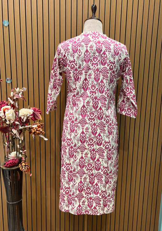 Stylish two-piece set features a white kurta adorned with a bold pink