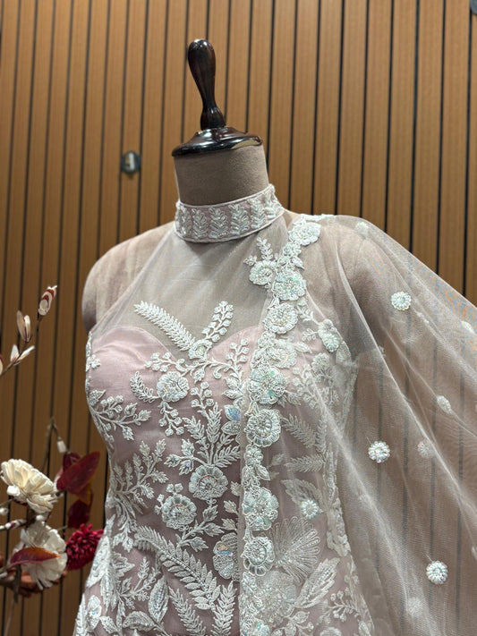 Grace and sophistication come together in this pastel pink embroidered sharara