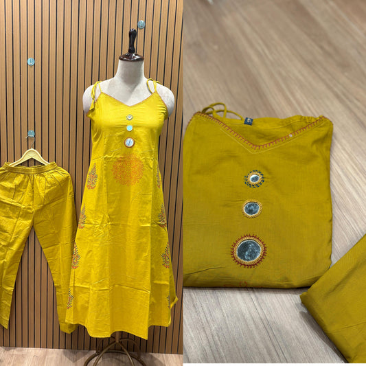 Vibrant mustard 2-piece stitched suit featuring a trendy strappy