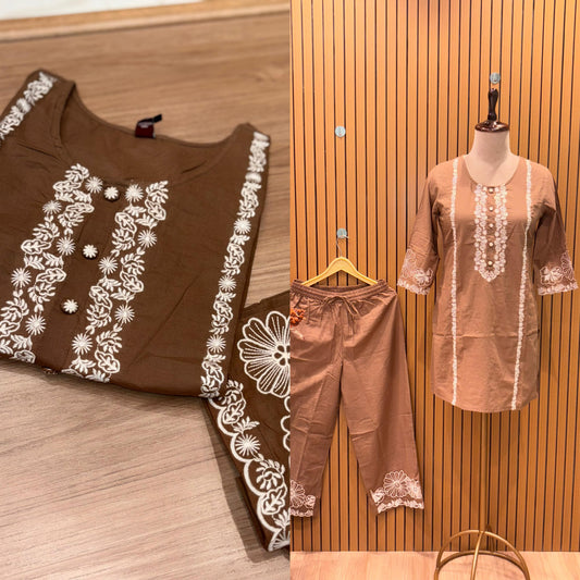 Stylish brown cotton co-ord set showcases elegant white floral