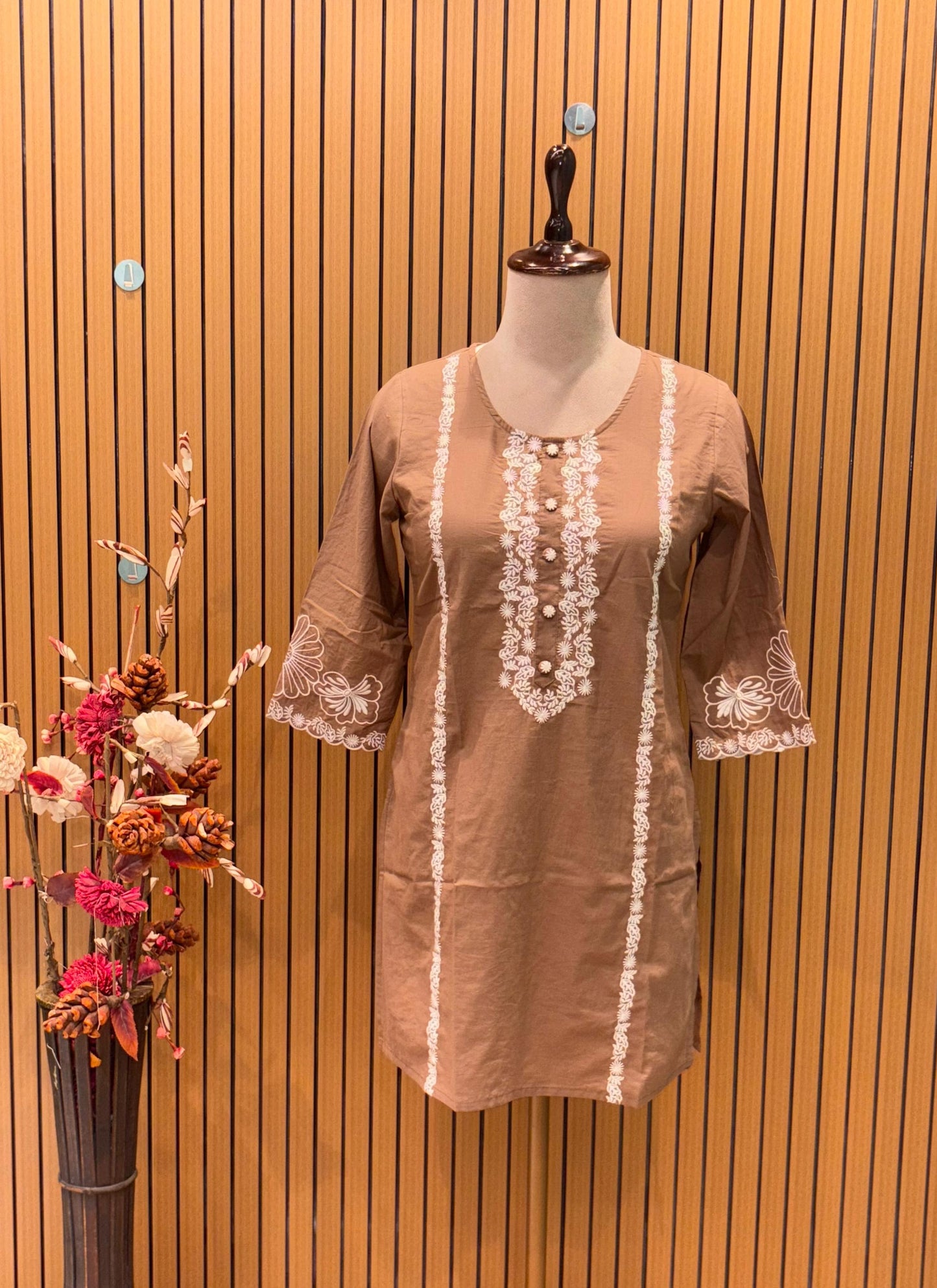 Stylish brown cotton co-ord set showcases elegant white floral