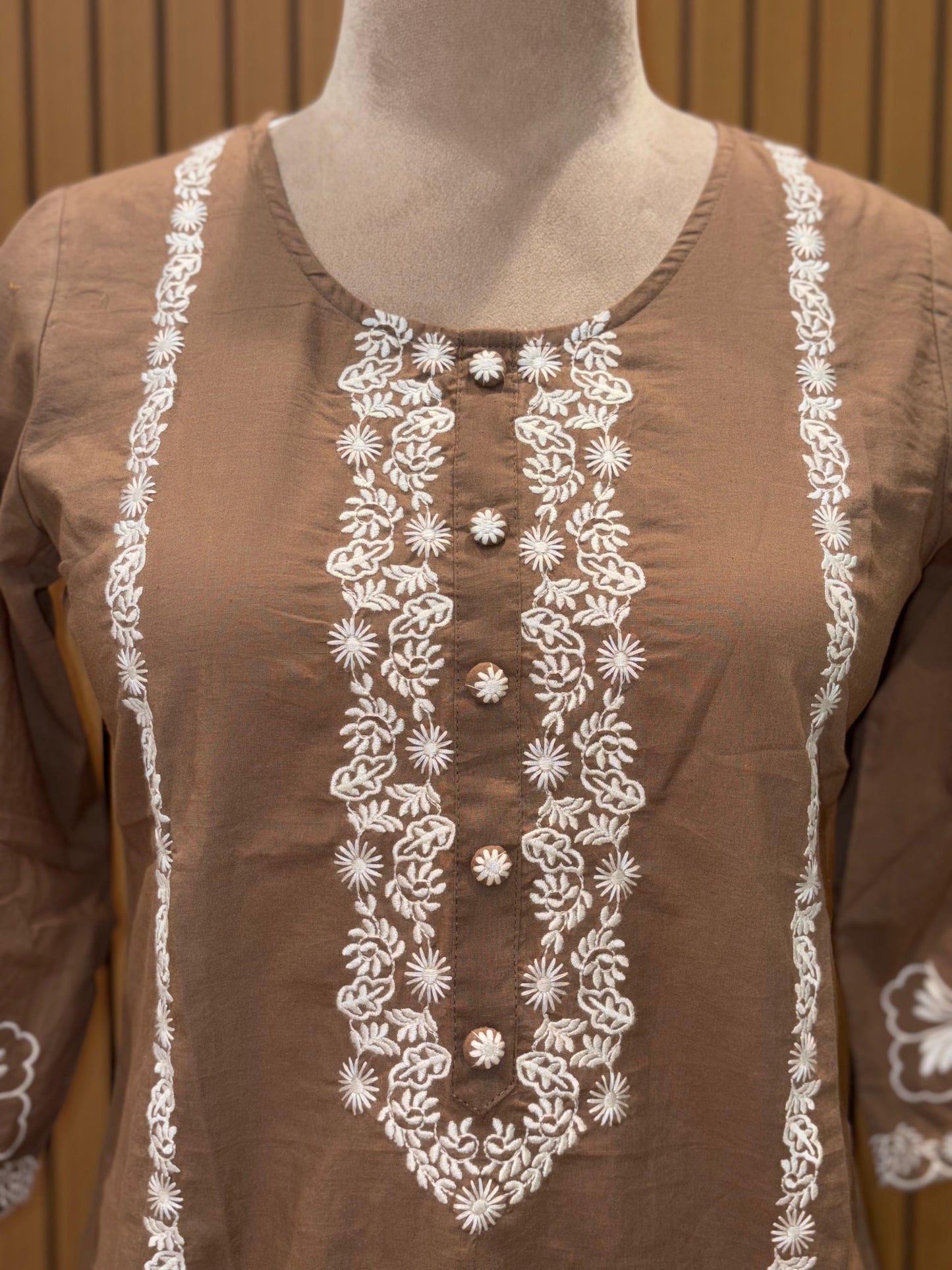 Stylish brown cotton co-ord set showcases elegant white floral