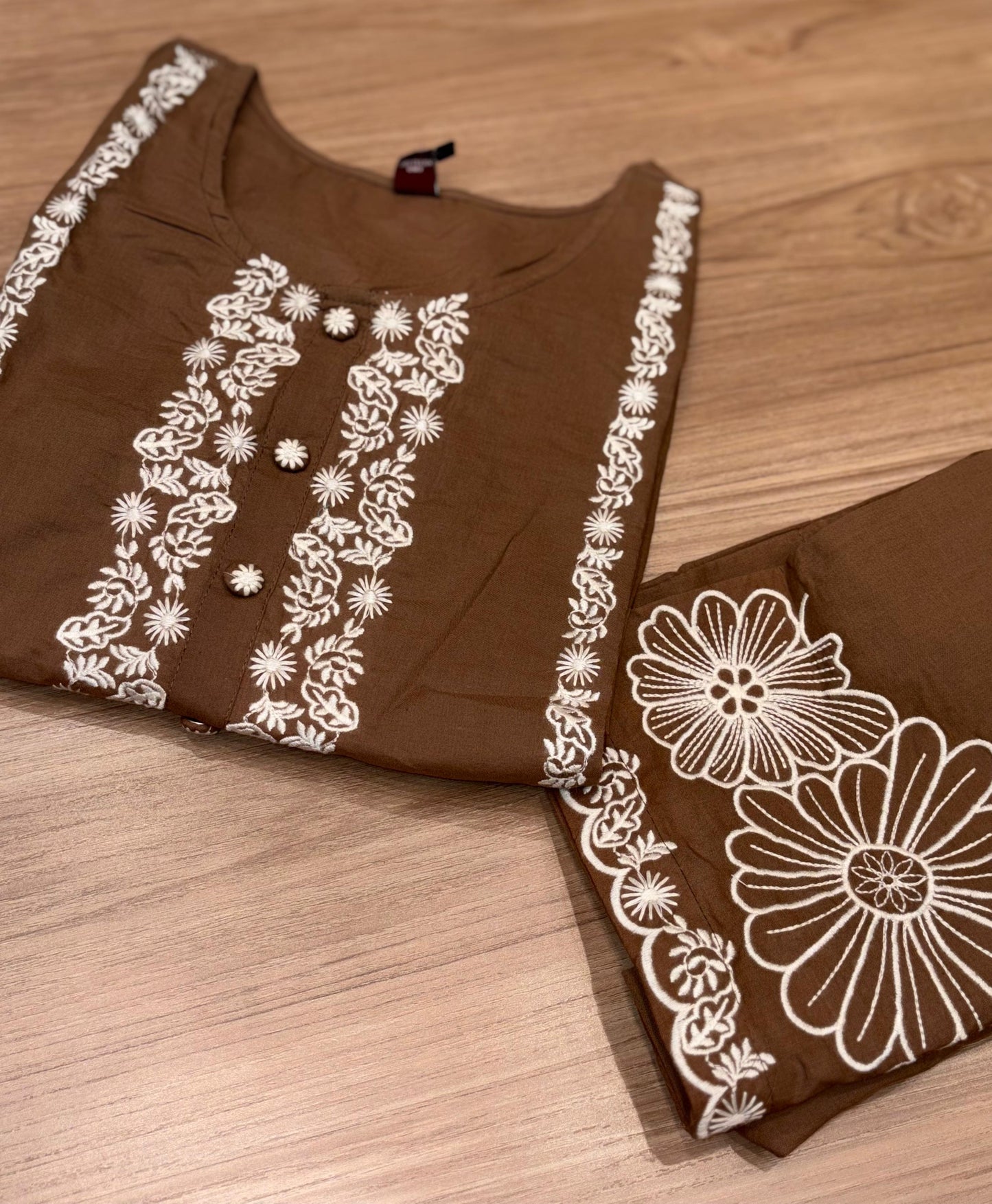 Stylish brown cotton co-ord set showcases elegant white floral