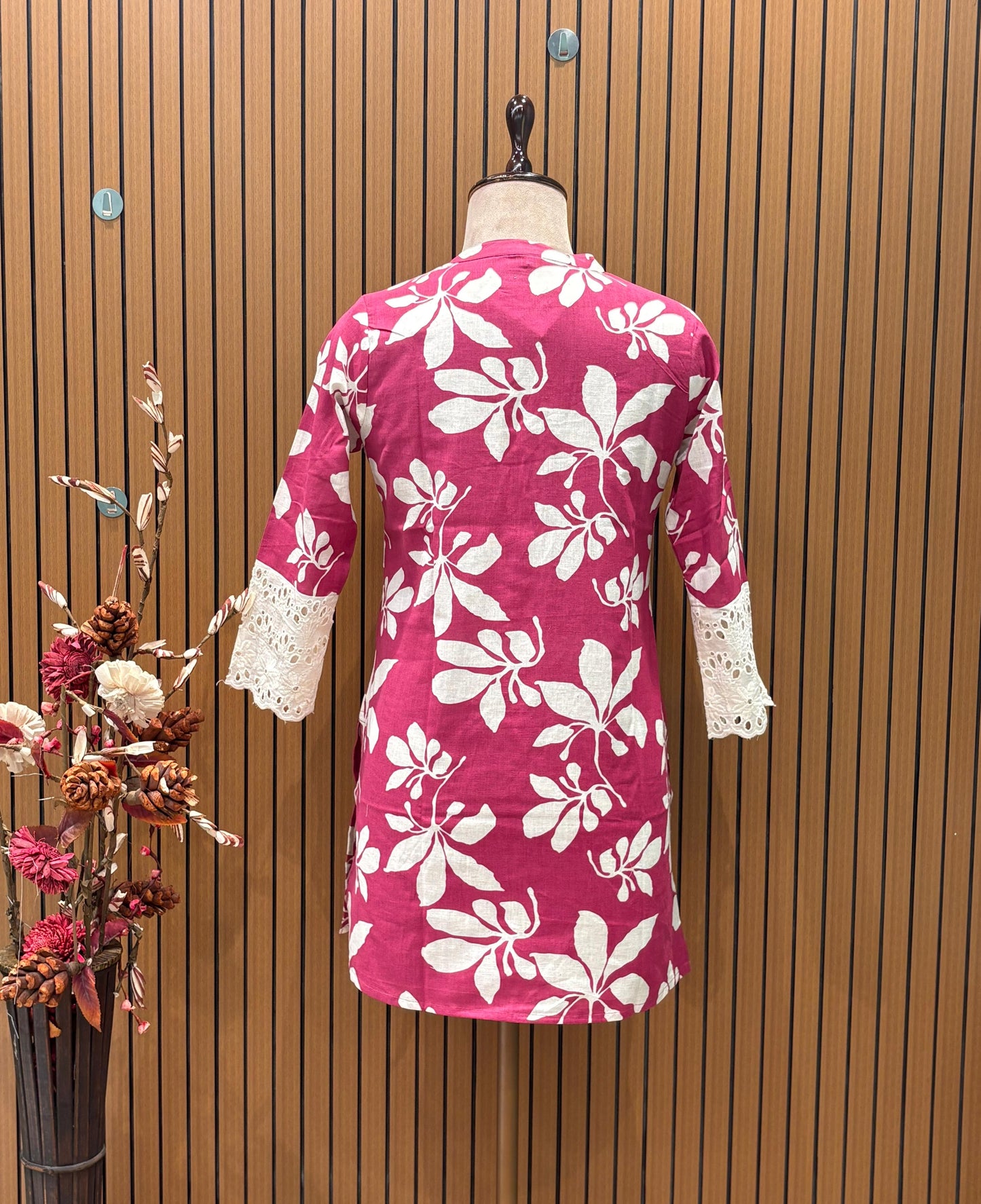 Vibrant magenta co-ord set features bold white floral prints