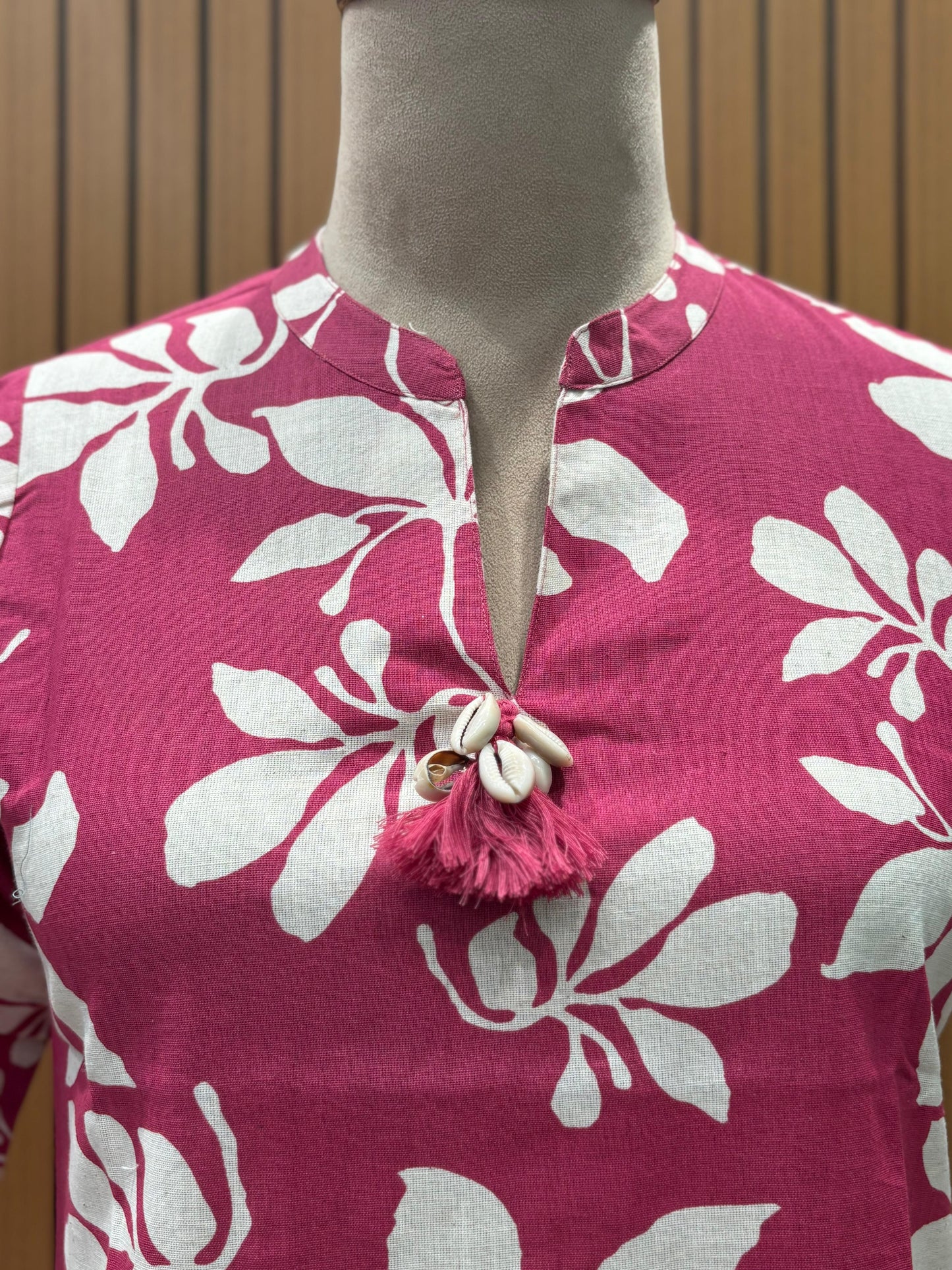Vibrant magenta co-ord set features bold white floral prints