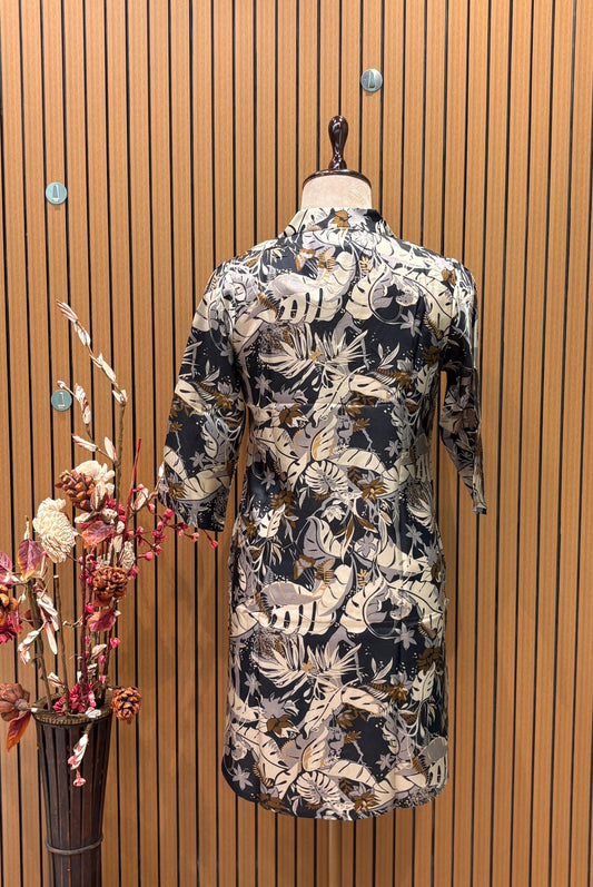 Trendy co-ord set features a dark tropical leaf