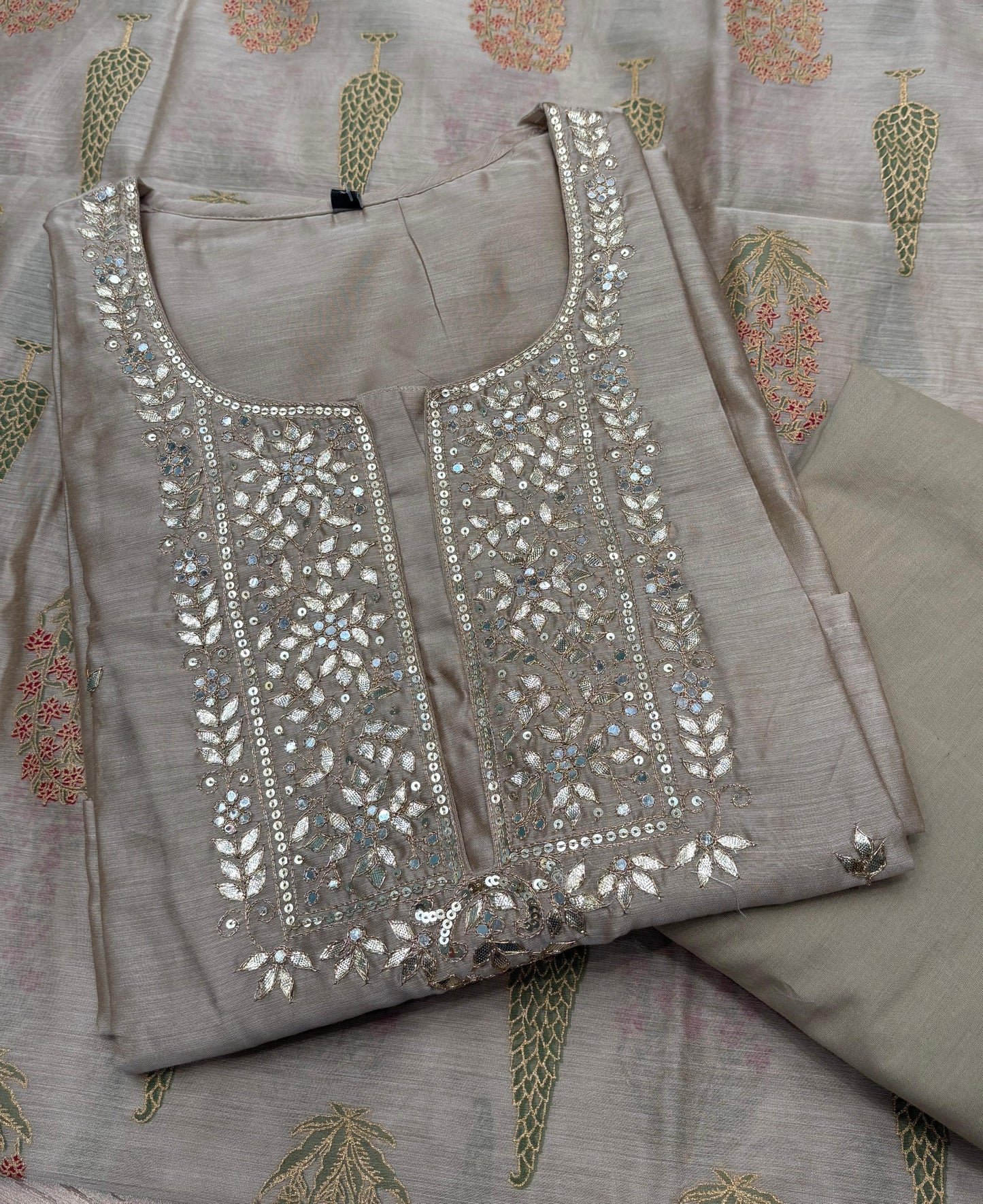 Graceful mul chanderi suit set featuring intricate mirror