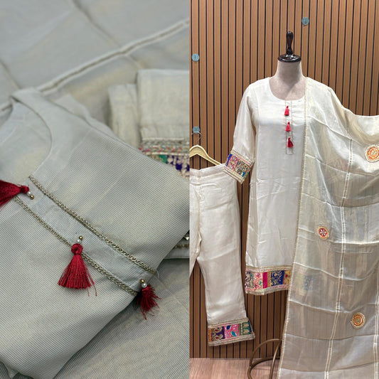 Step into understated elegance with this ivory silk-blend kurti set