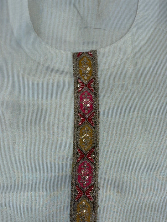 Exude regal charm in this exquisite ivory silk suit set