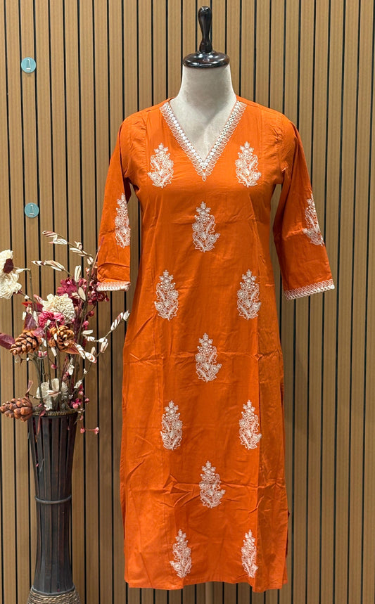 Radiate festive charm in this vibrant orange cotton suit