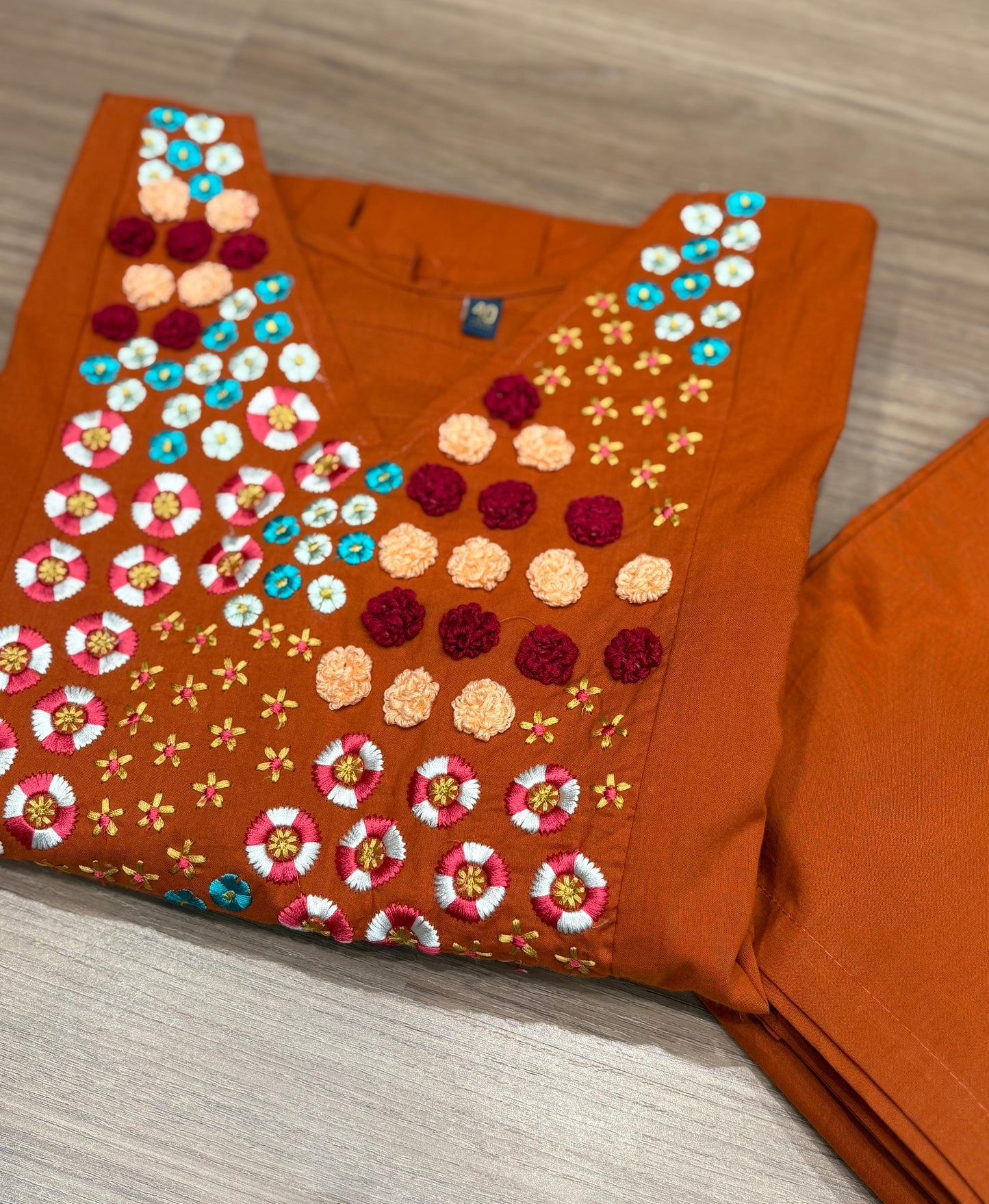 Brighten your wardrobe with this vibrant orange A-line kurti set