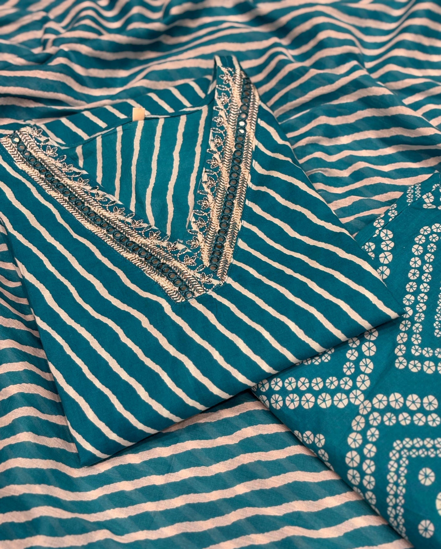 Make a statement in this vibrant turquoise kurti set