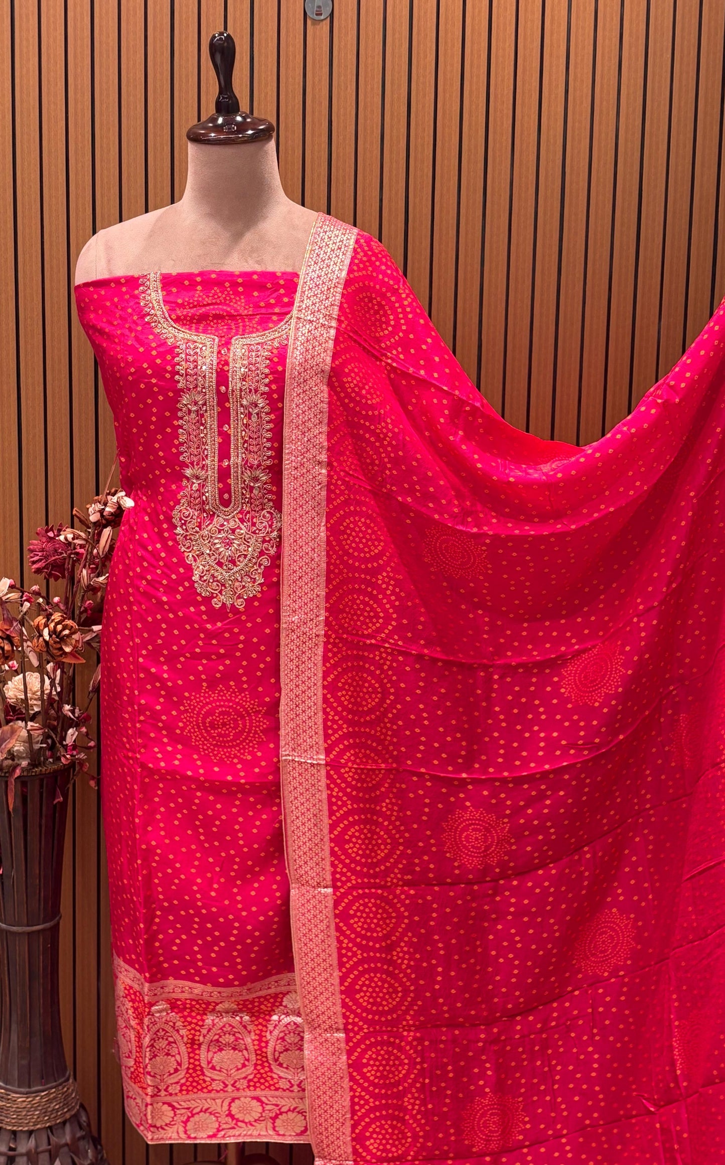 Add a regal charm to your festive wardrobe with this unstitched suit