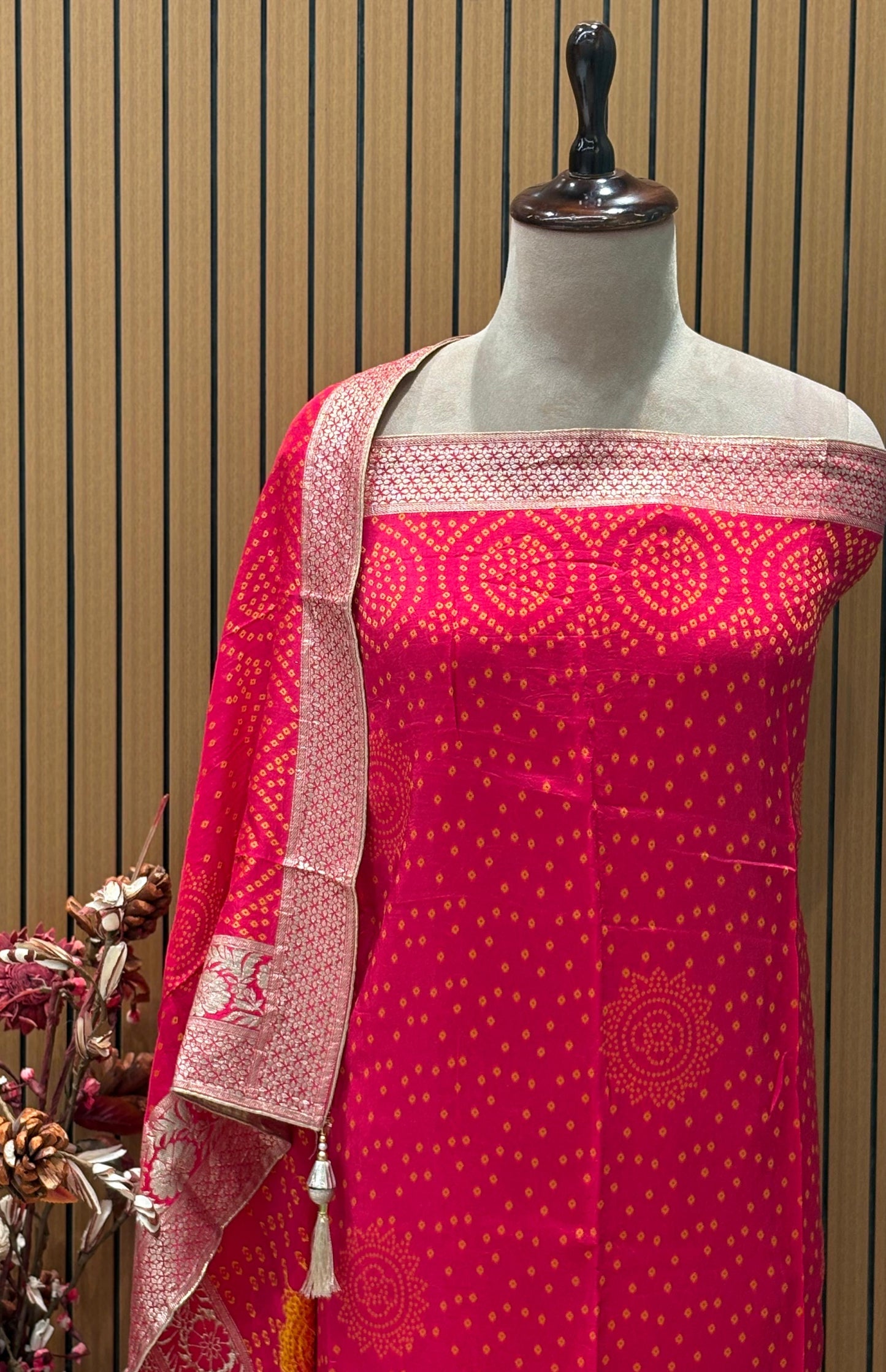 Add a regal charm to your festive wardrobe with this unstitched suit