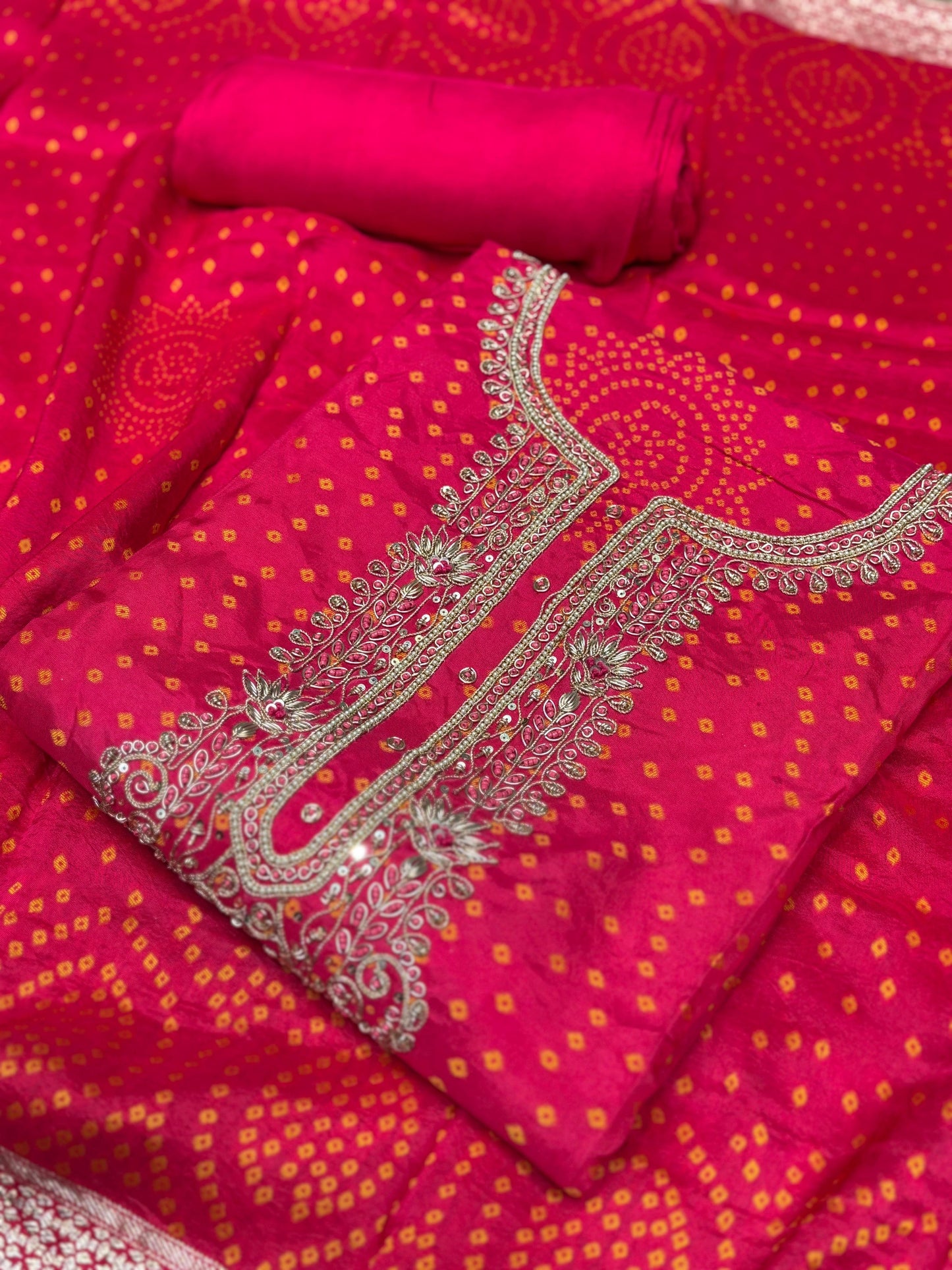 Add a regal charm to your festive wardrobe with this unstitched suit