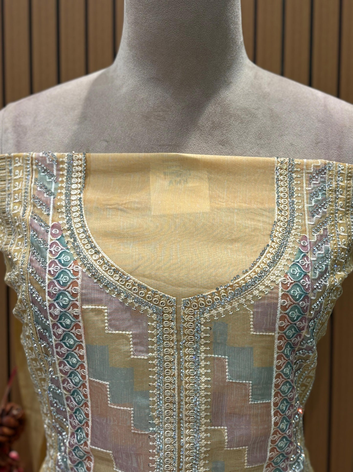 Presenting an elegant unstitched suit set in a soothing mustard-gold hue