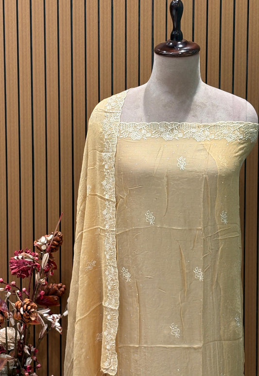 Presenting an elegant unstitched suit set in a soothing mustard-gold hue