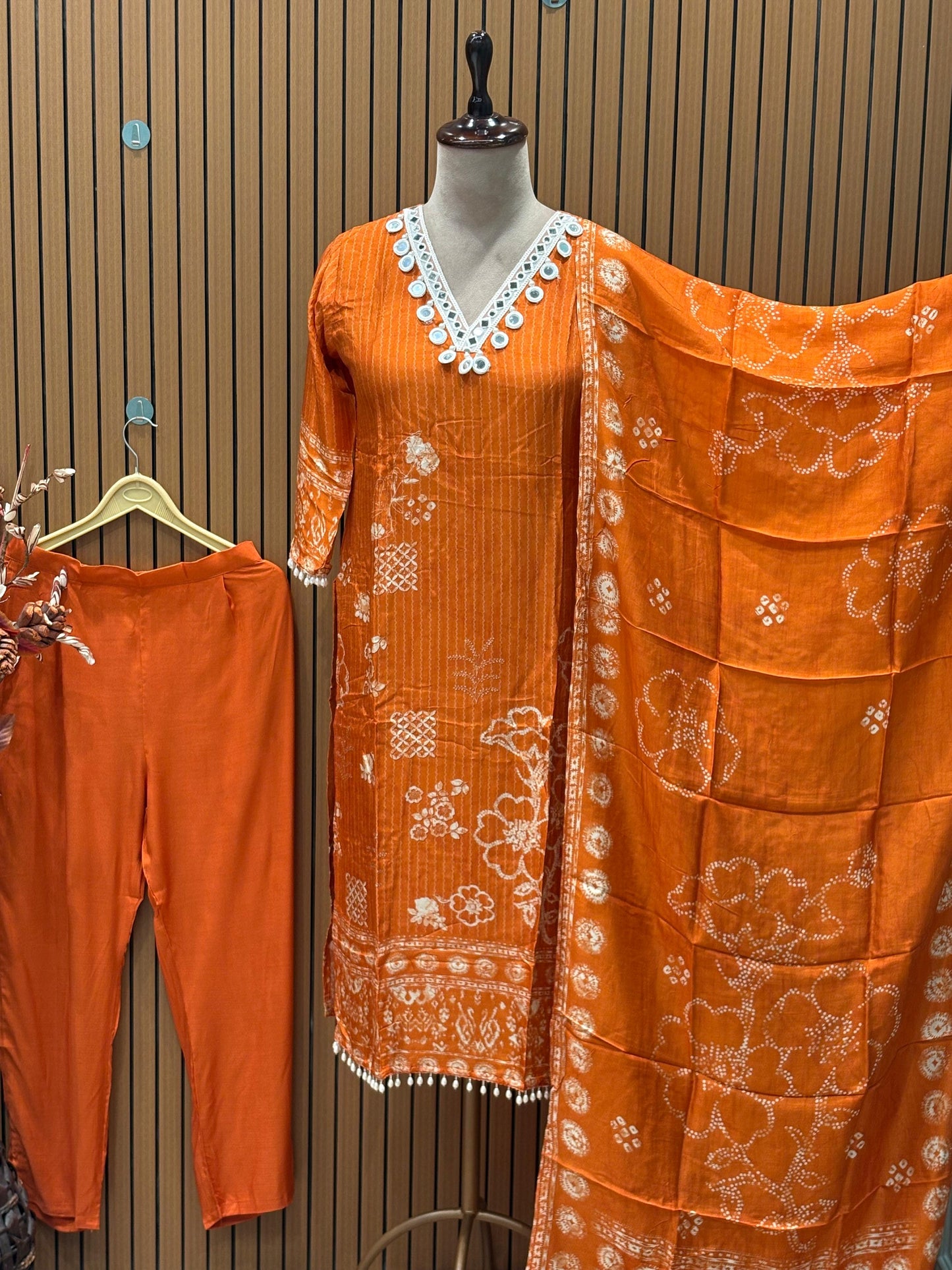 Orange cotton suit with shell mirror work neckline