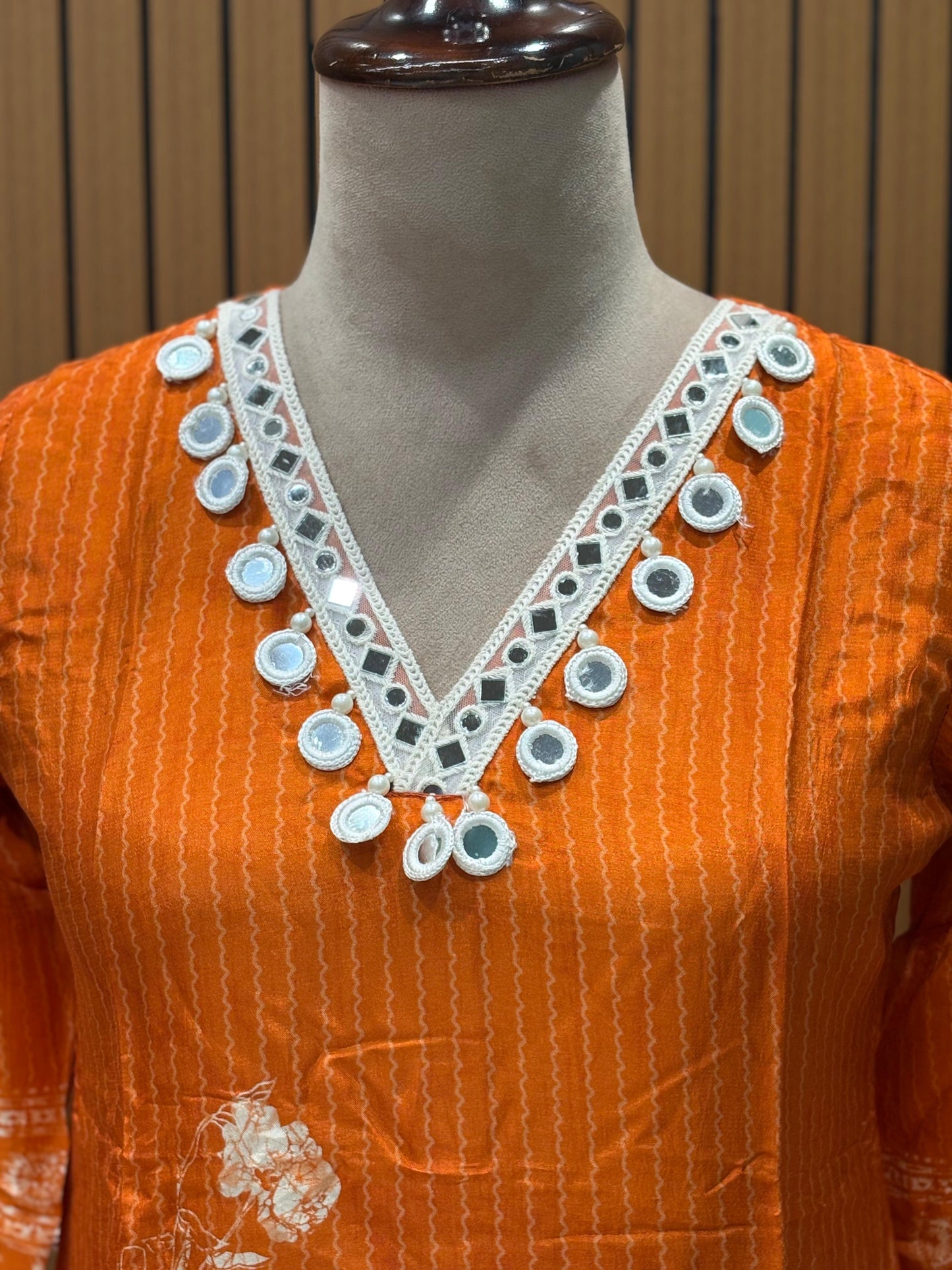 Orange cotton suit with shell mirror work neckline