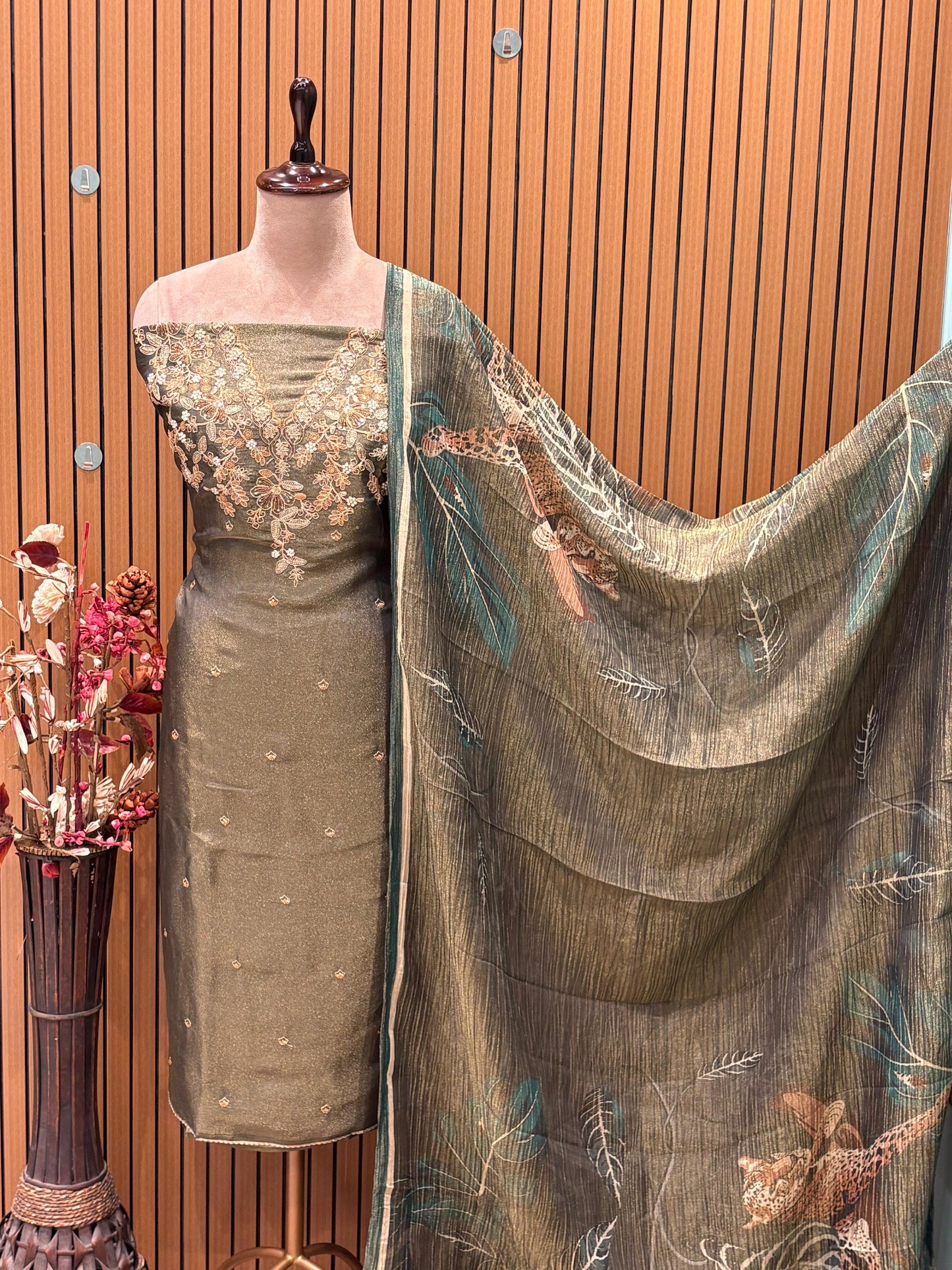Unveil the charm of elegance with this olive green unstitched suit set