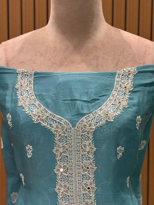 Elevate your festive wardrobe with this exquisite unstitched suit set