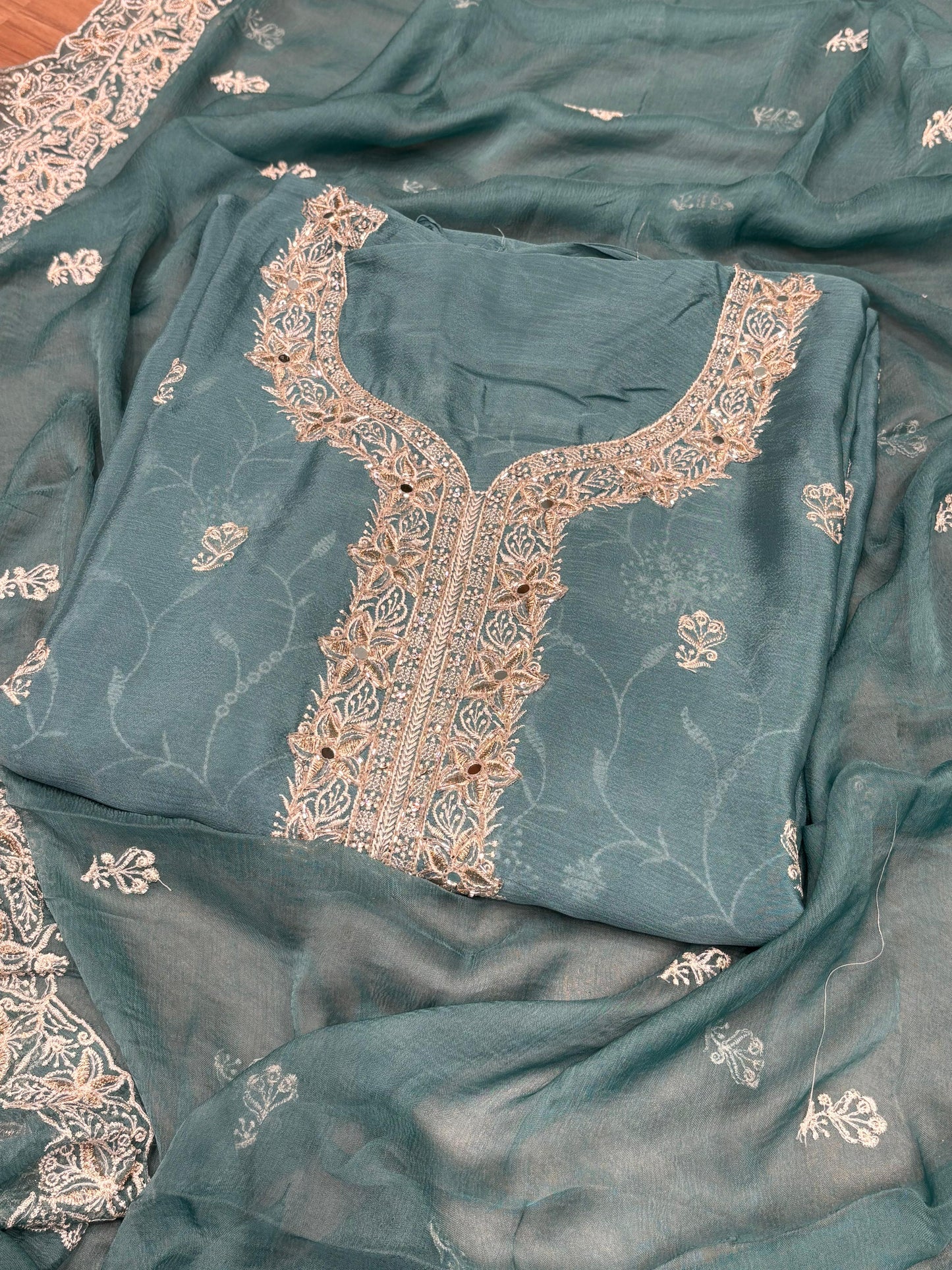 Elevate your festive wardrobe with this exquisite unstitched suit set