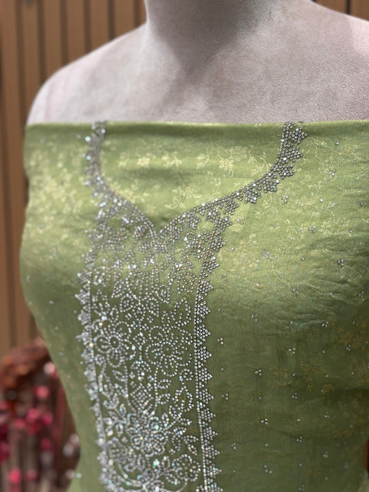 Unveil festive elegance with this stunning unstitched suit