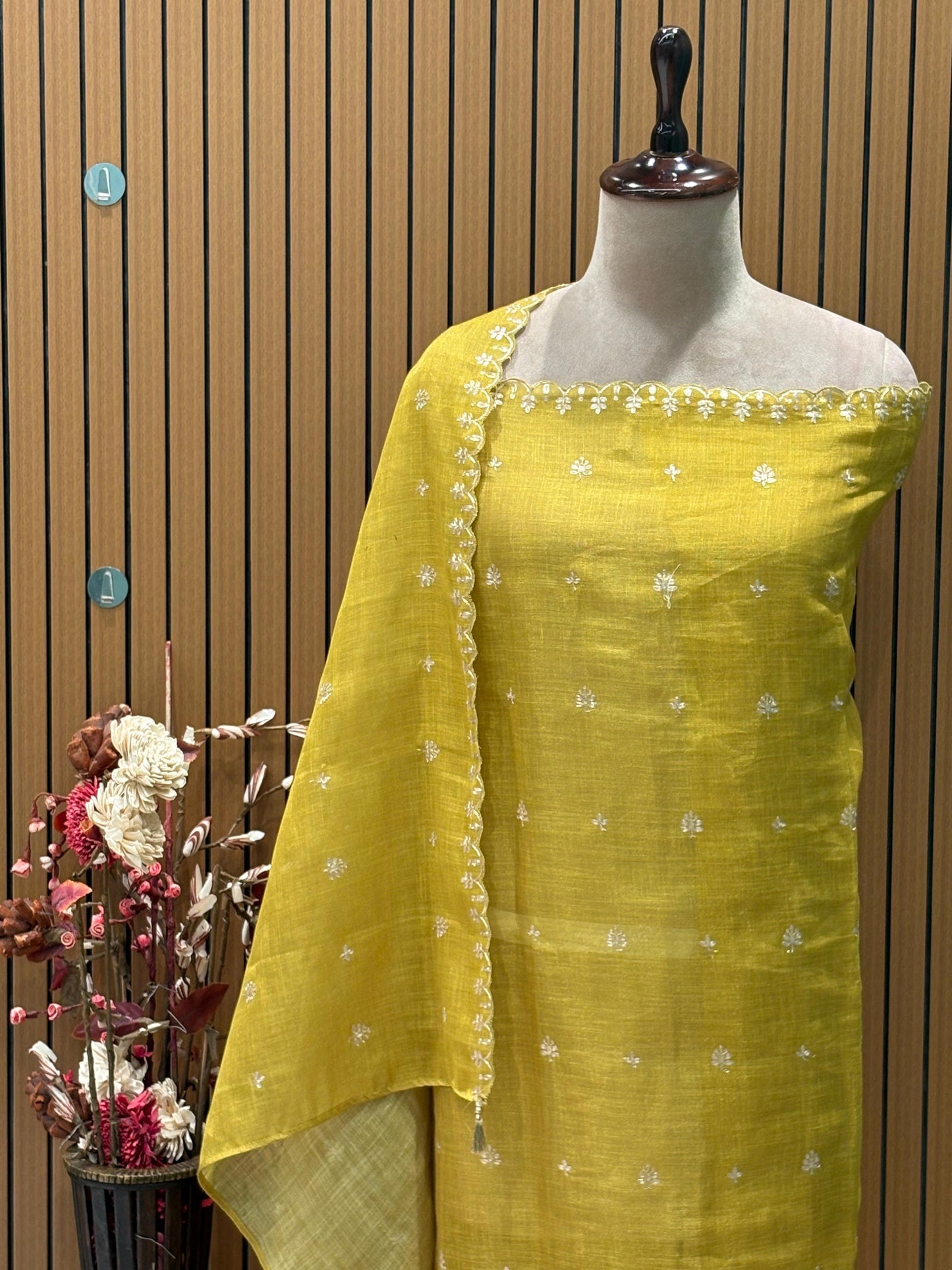 Step into festive finesse with this unstitched suit set